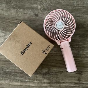 Pink handheld fan with usb charger